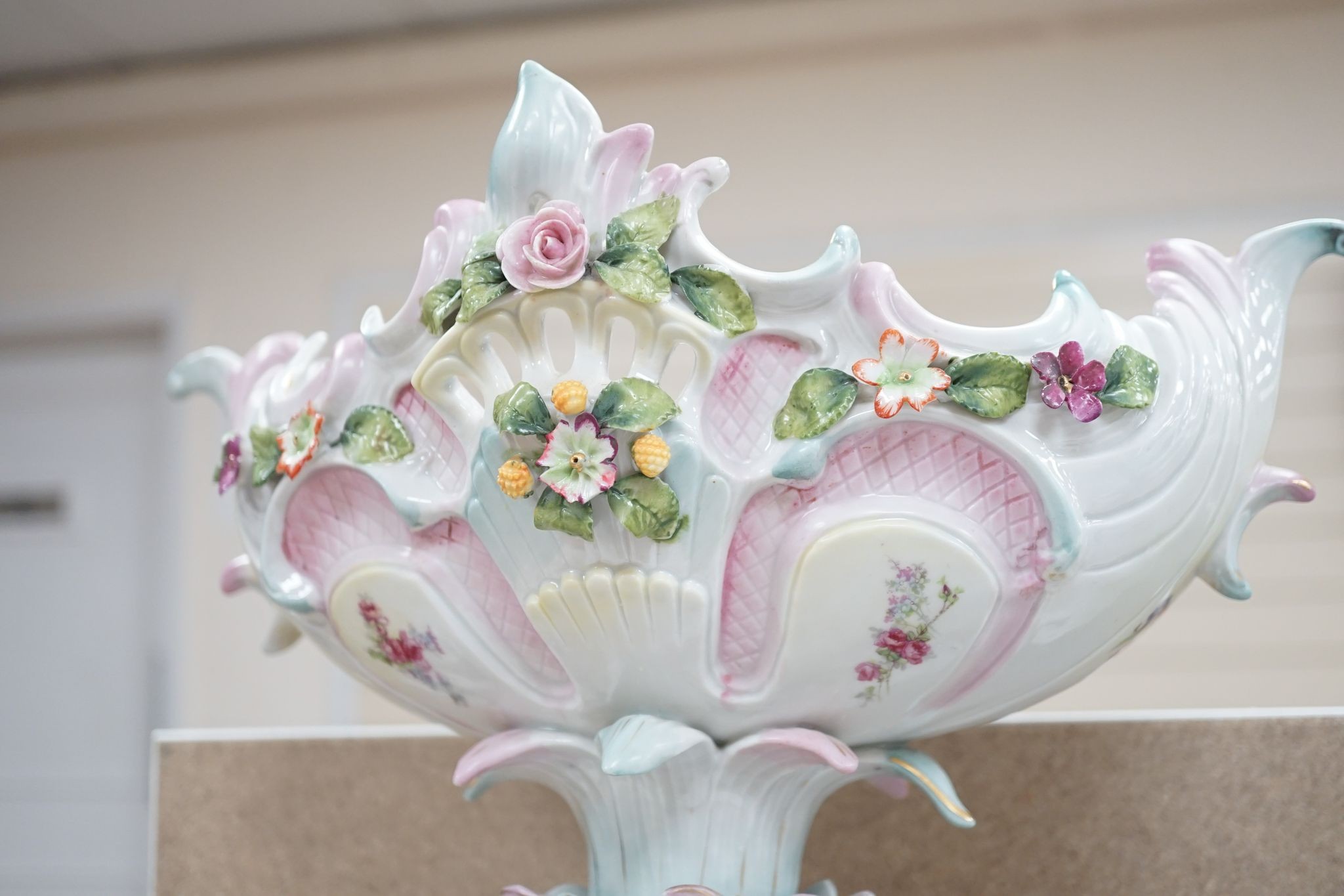 A tall German porcelain figural centrepiece bowl and two others smaller. Tallest 47cm